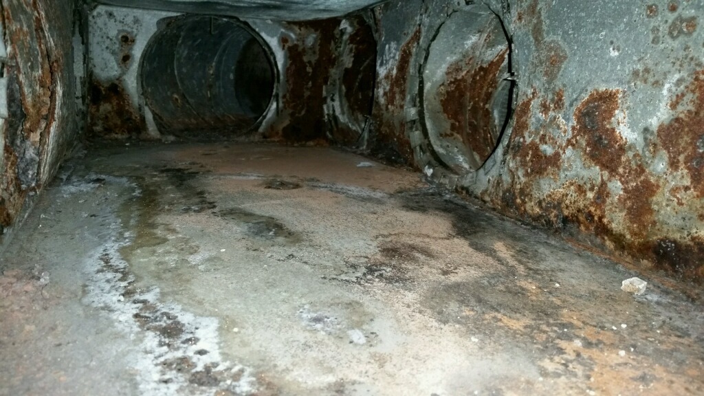 rusty, moldy air duct - before cleaning and sealing