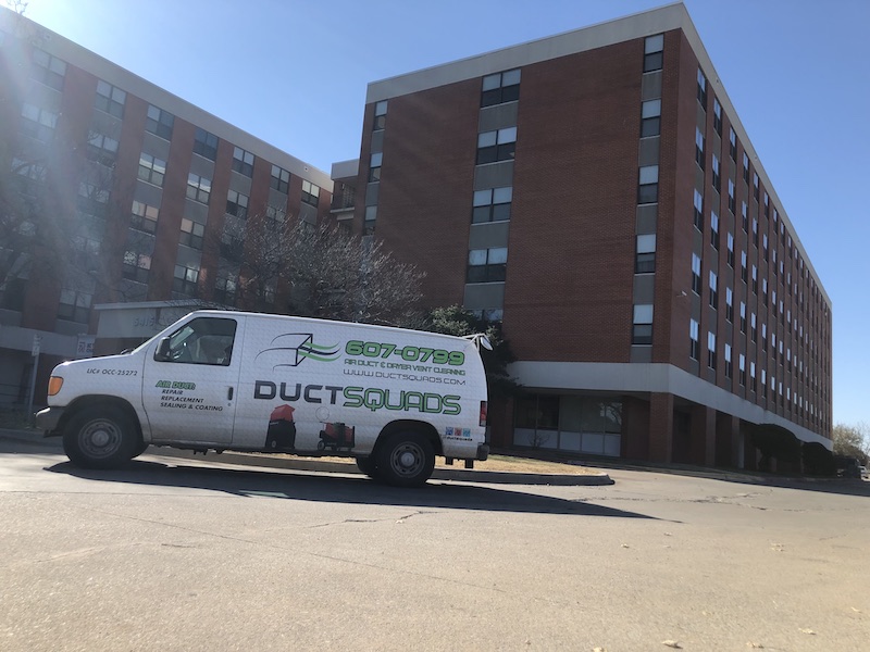 duct squads van at commercial building